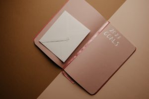 pink notebook on the table
